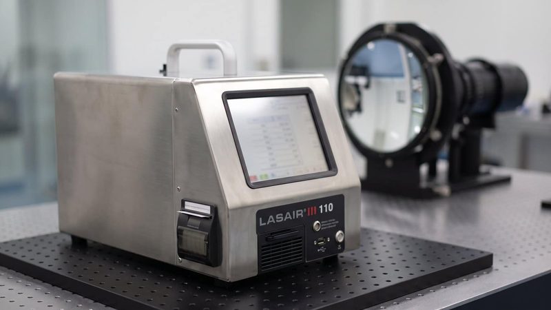 PMS Lasair III 110 particle counter on an optical table
